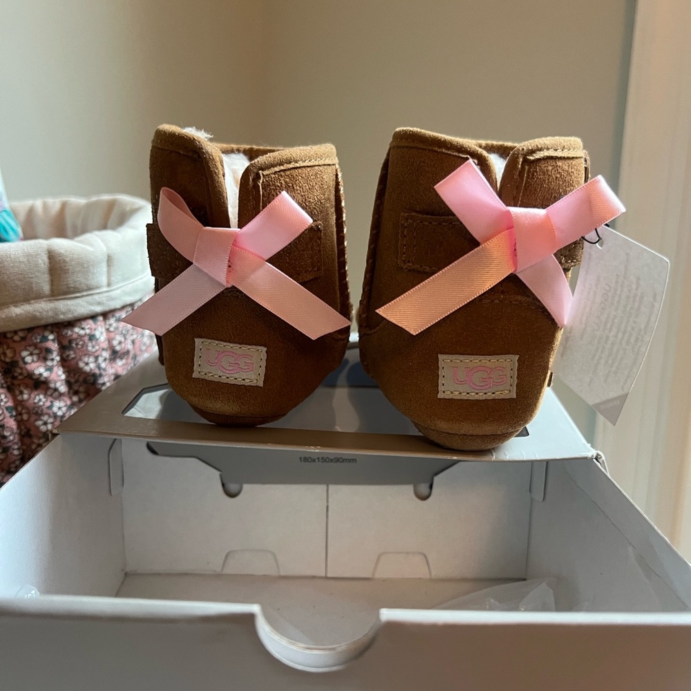 Baby UGGs with pink bow. Size 04/05.